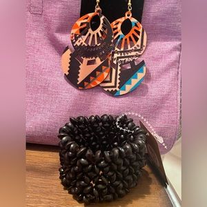 Colorful earrings and black bracelet